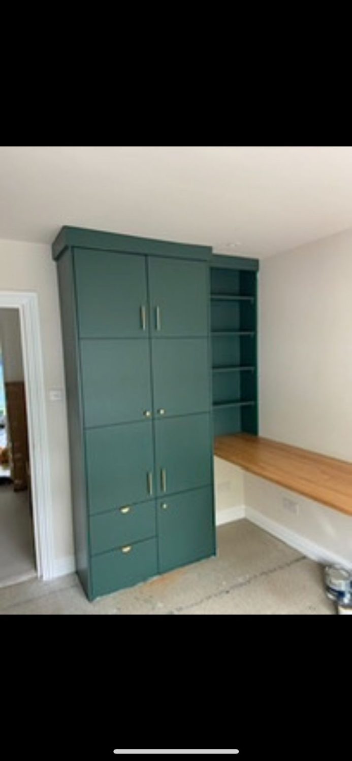Painted fitted cabinetry and desk
